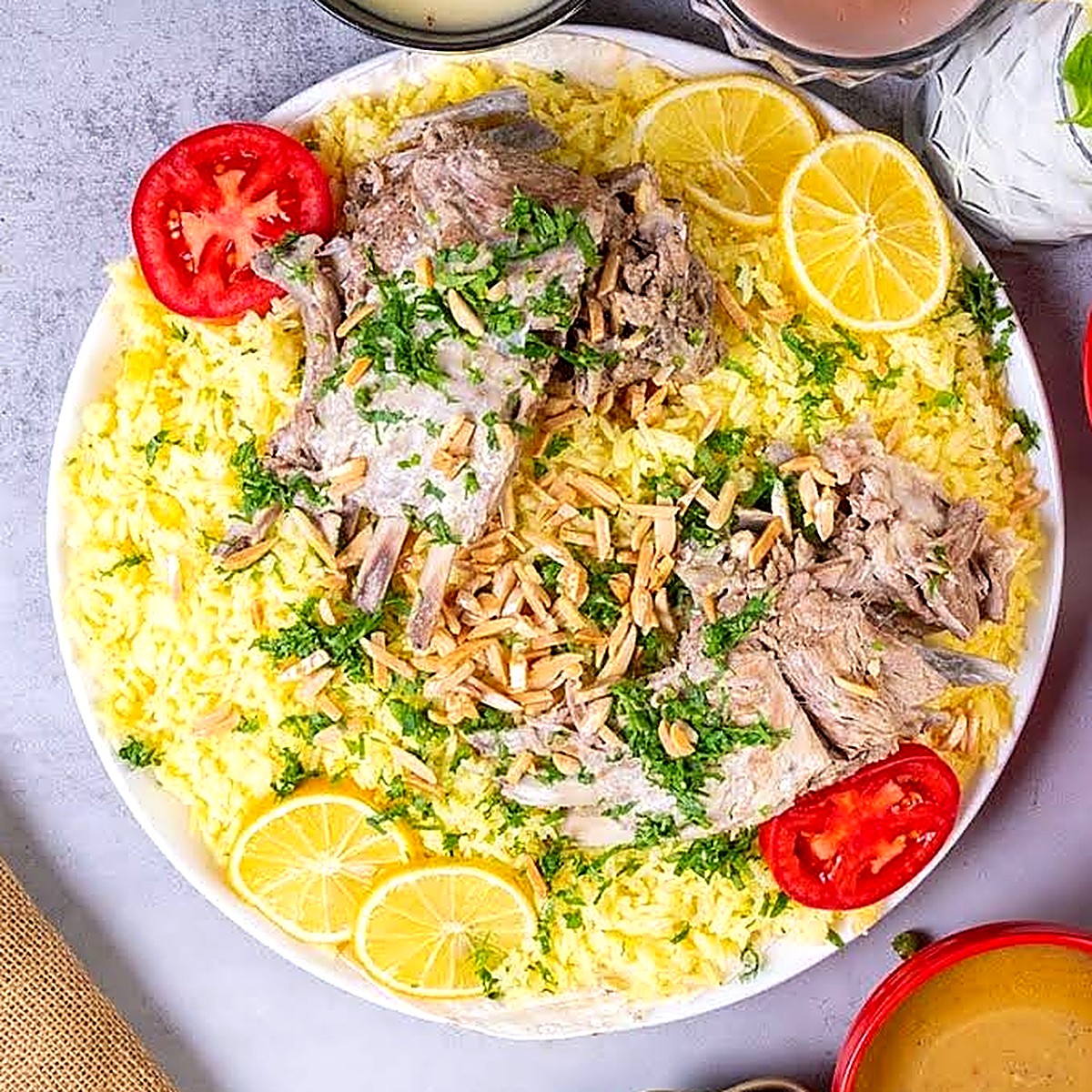Lamb quzi over saffron rice with almonds, parsley and lemon